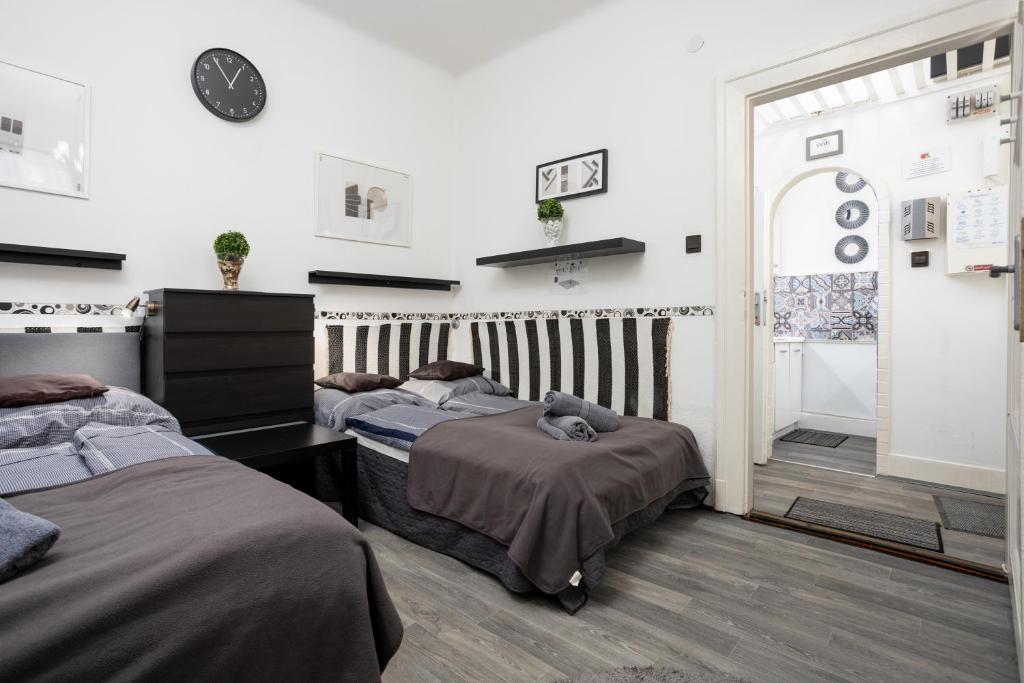 Posteľ alebo postele v izbe v ubytovaní Gecko Centrum Studio Apartman