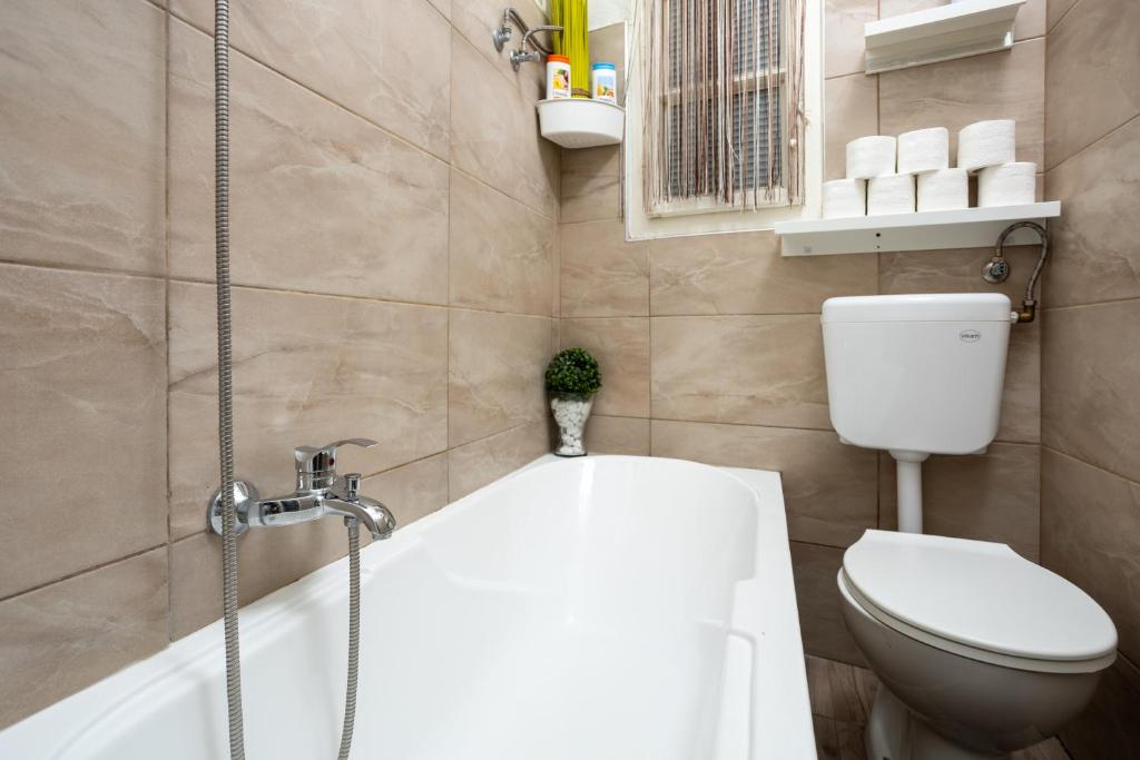 Kúpeľňa v ubytovaní Gecko Centrum Studio Apartman