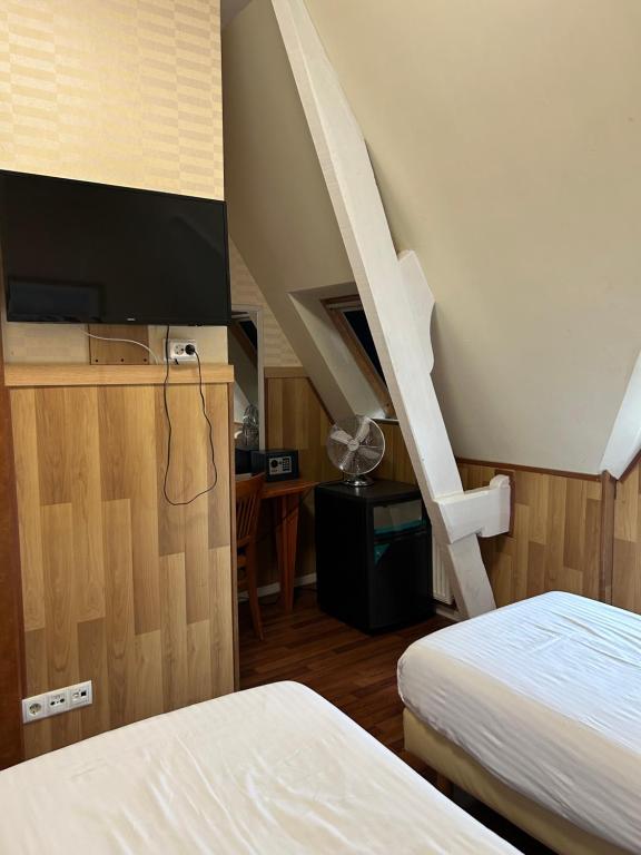 Postel nebo postele na pokoji v ubytování Hotel Isis
