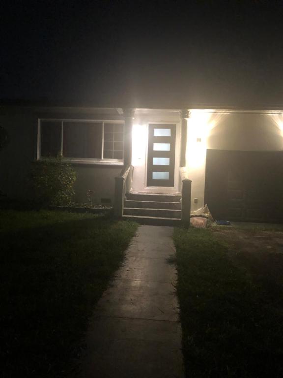 a house with a light on the front door at night at Josiane Peace of stay in Miami