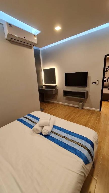 Postel nebo postele na pokoji v ubytování Wonder Hills Pool Villa Pattaya 泳池别墅