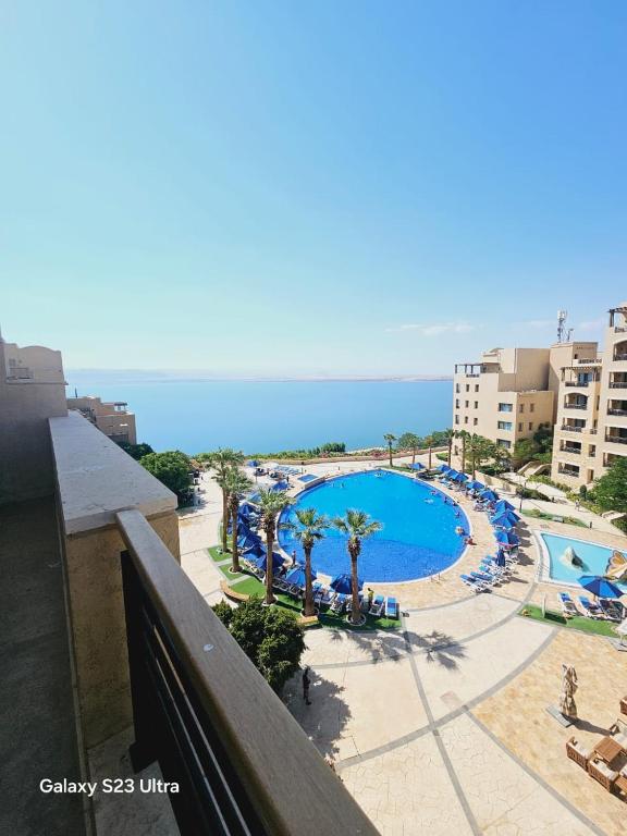 a view of a swimming pool at a resort at B36 Loft Apartment Samarah Resort in Sowayma