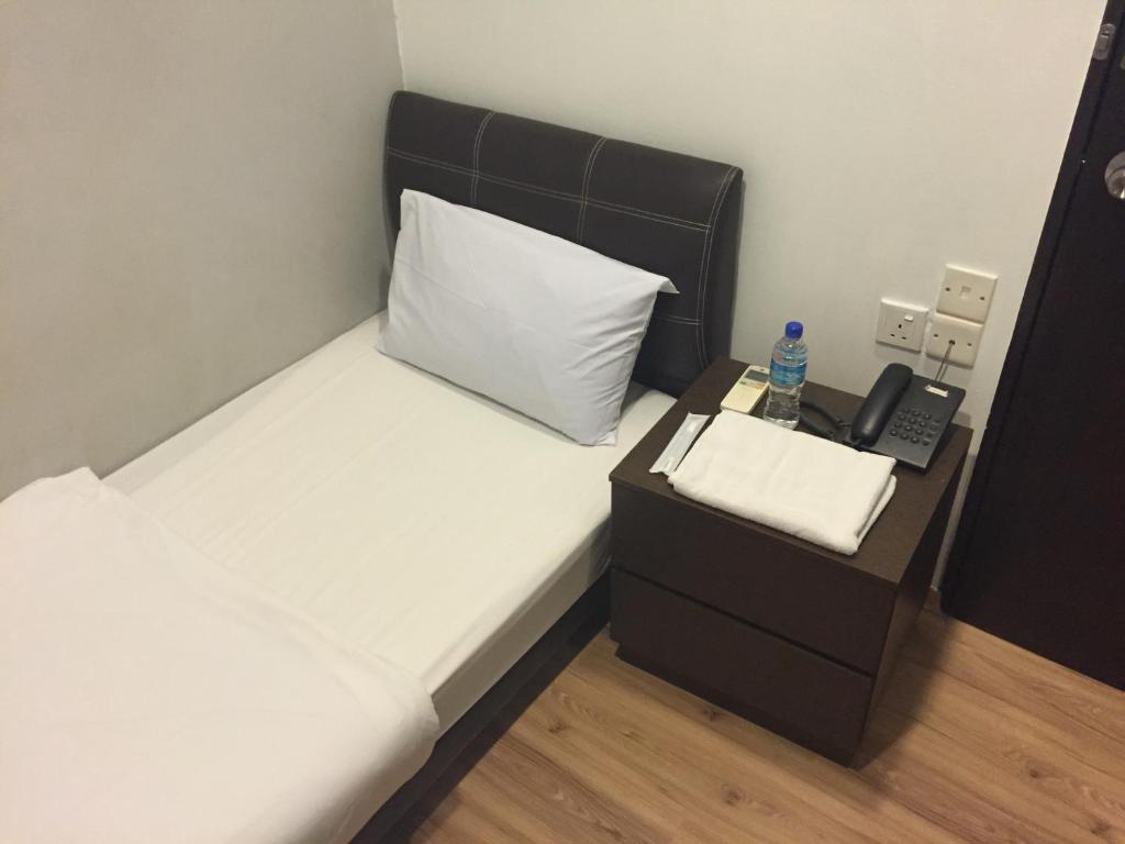Postel nebo postele na pokoji v ubytování Hotel Conforto