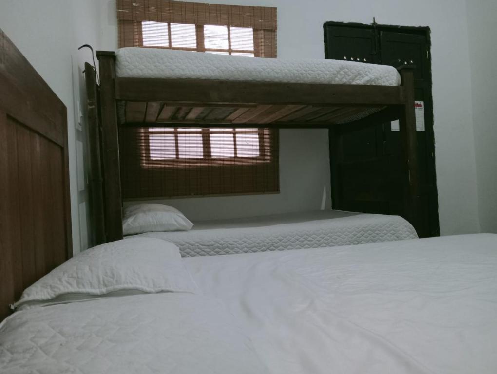 Postel nebo postele na pokoji v ubytování Villa Candelaria Hostel