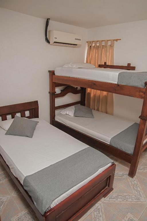 Postel nebo postele na pokoji v ubytování Casa María - Hotel Boutique
