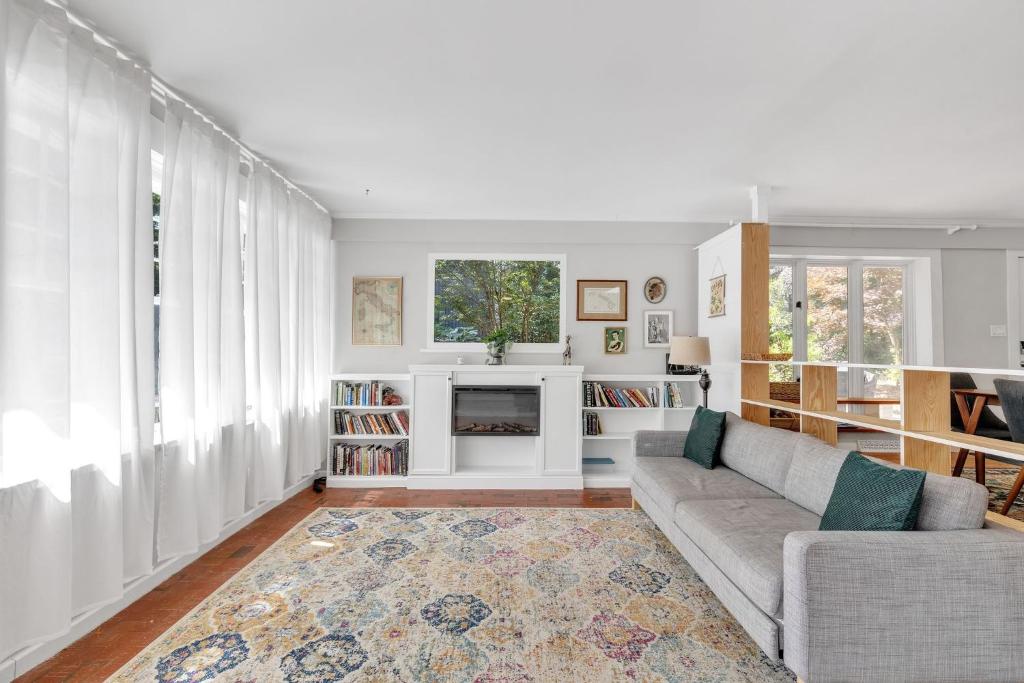 a living room with a couch and a fireplace at Robin's Rest home in Chapel Hill