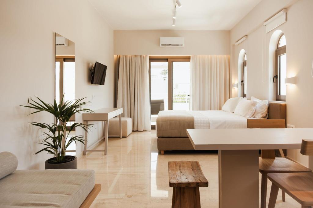 A bed or beds in a room at Ariadne Suites