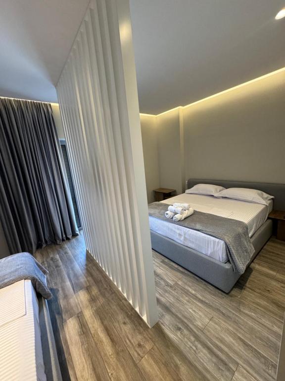 Postel nebo postele na pokoji v ubytování W Cika Hotel