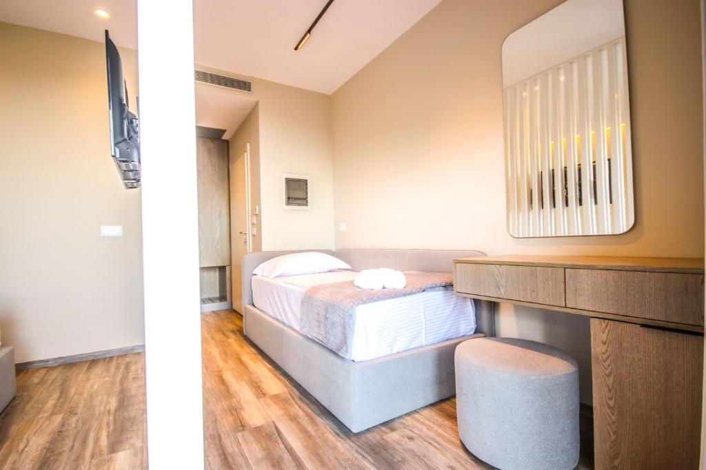 Postel nebo postele na pokoji v ubytování W Cika Hotel