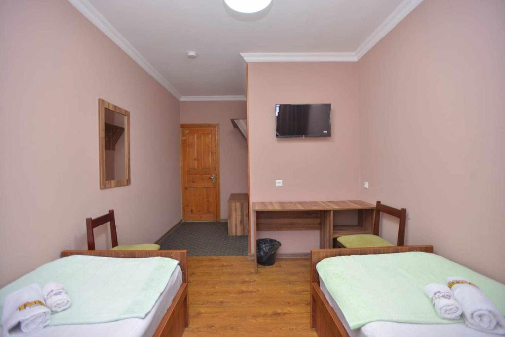 Voodi või voodid majutusasutuse Hotel Nikea Paradiso toas
