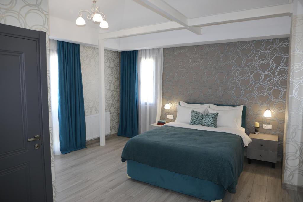 Postel nebo postele na pokoji v ubytování Hotel Saguramo Bliss