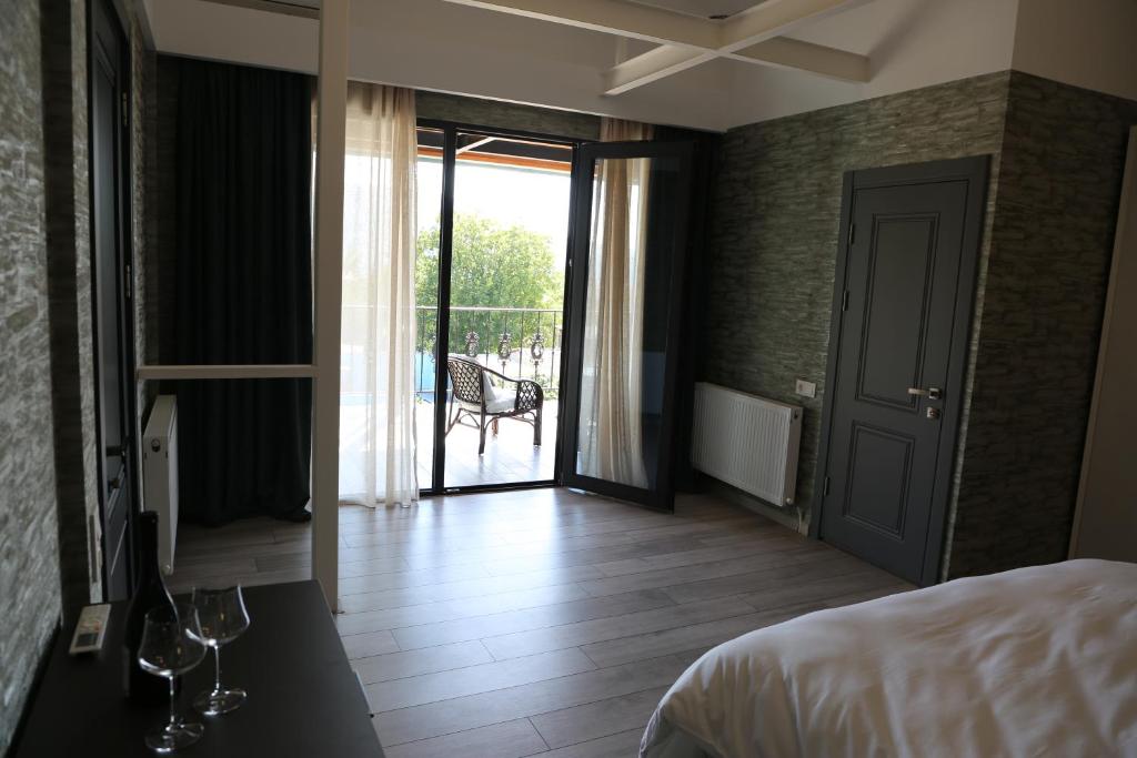 Postel nebo postele na pokoji v ubytování Hotel Saguramo Bliss