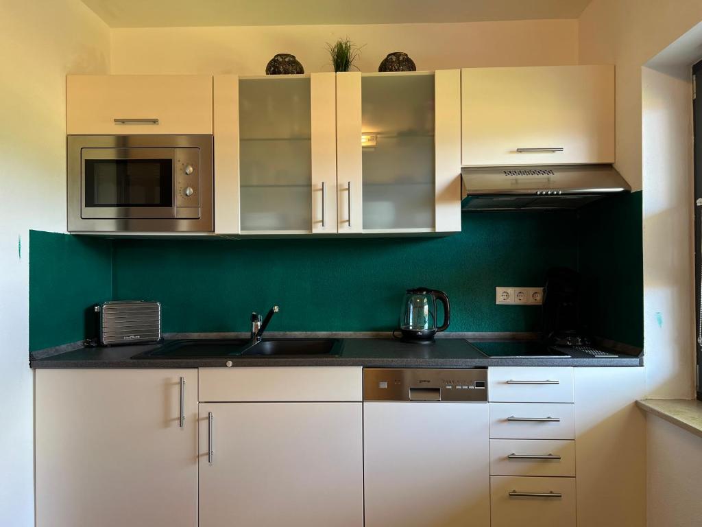 Kuchyň nebo kuchyňský kout v ubytování Appartement Alpblick