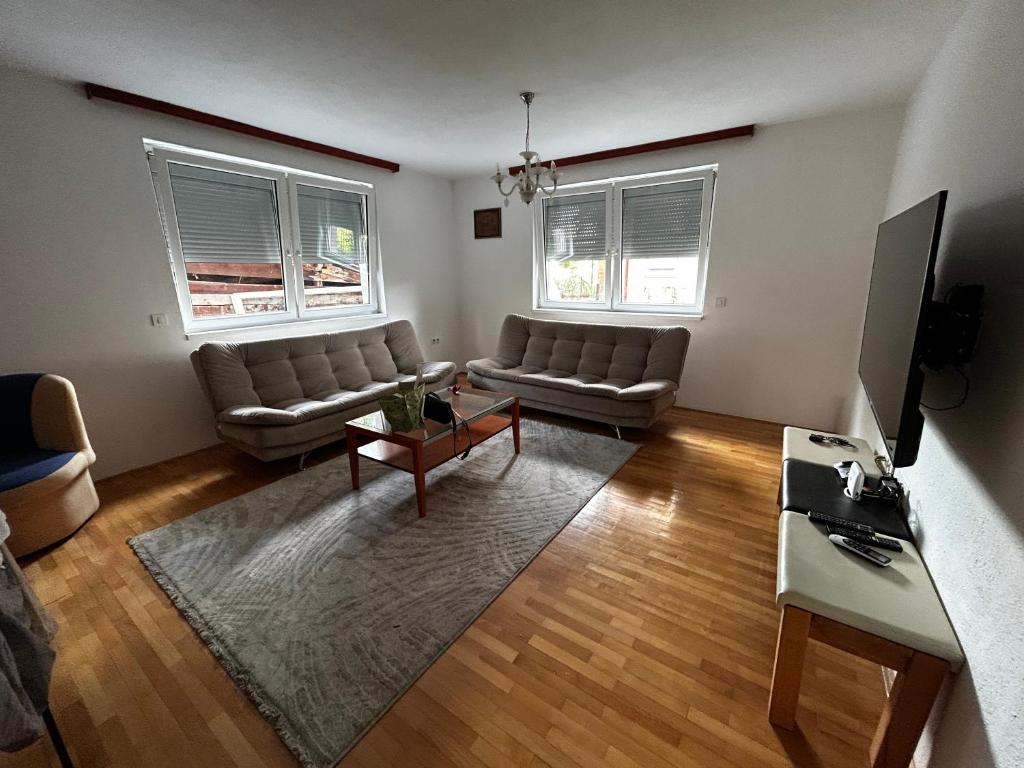 a living room with a couch and a table at Ilidza Apartments in Sarajevo