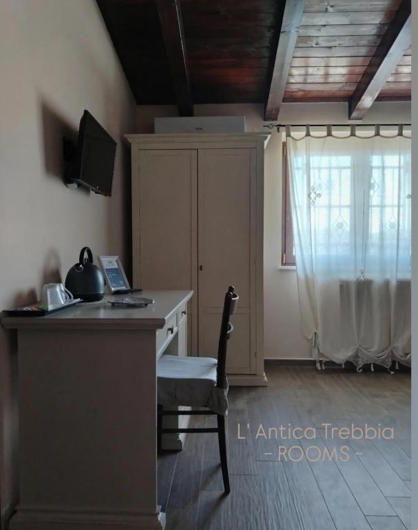 Televízia a/alebo spoločenská miestnosť v ubytovaní L' Antica Trebbia - Rooms