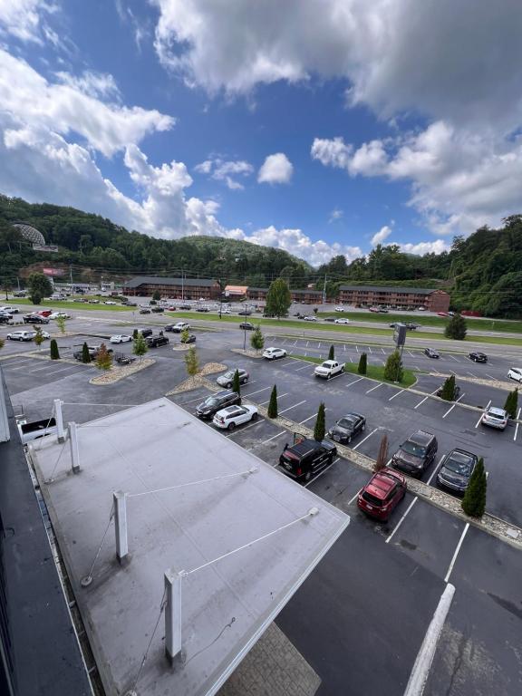 an aerial view of a parking lot with cars at Country Inn & Suites by Radisson, Pigeon Forge South, TN in Pigeon Forge
