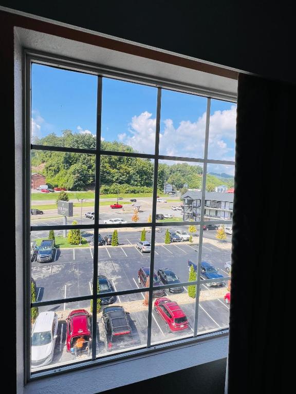 a view of a parking lot from a window at Country Inn & Suites by Radisson, Pigeon Forge South, TN in Pigeon Forge