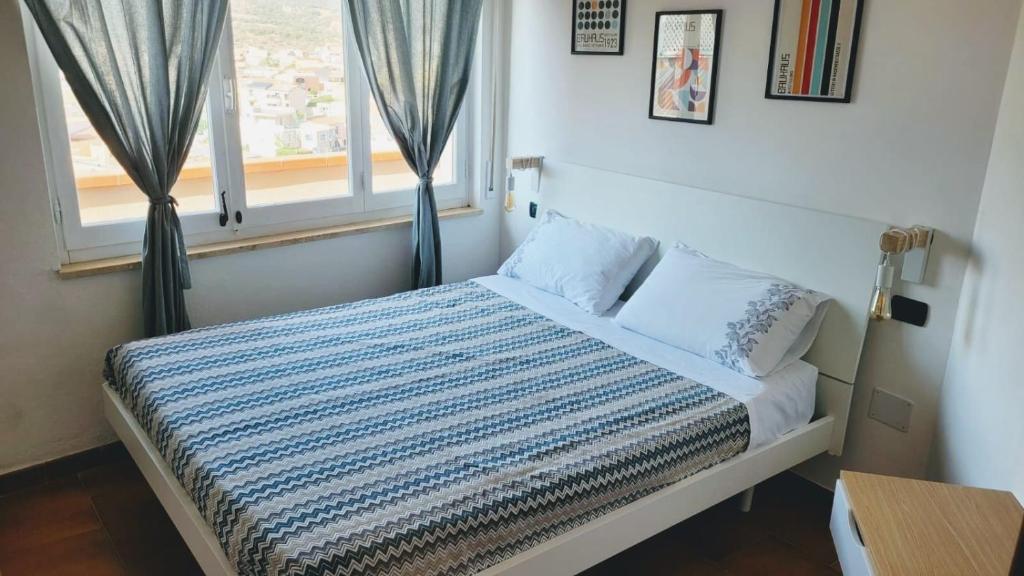 Postel nebo postele na pokoji v ubytování A casa di Pintus