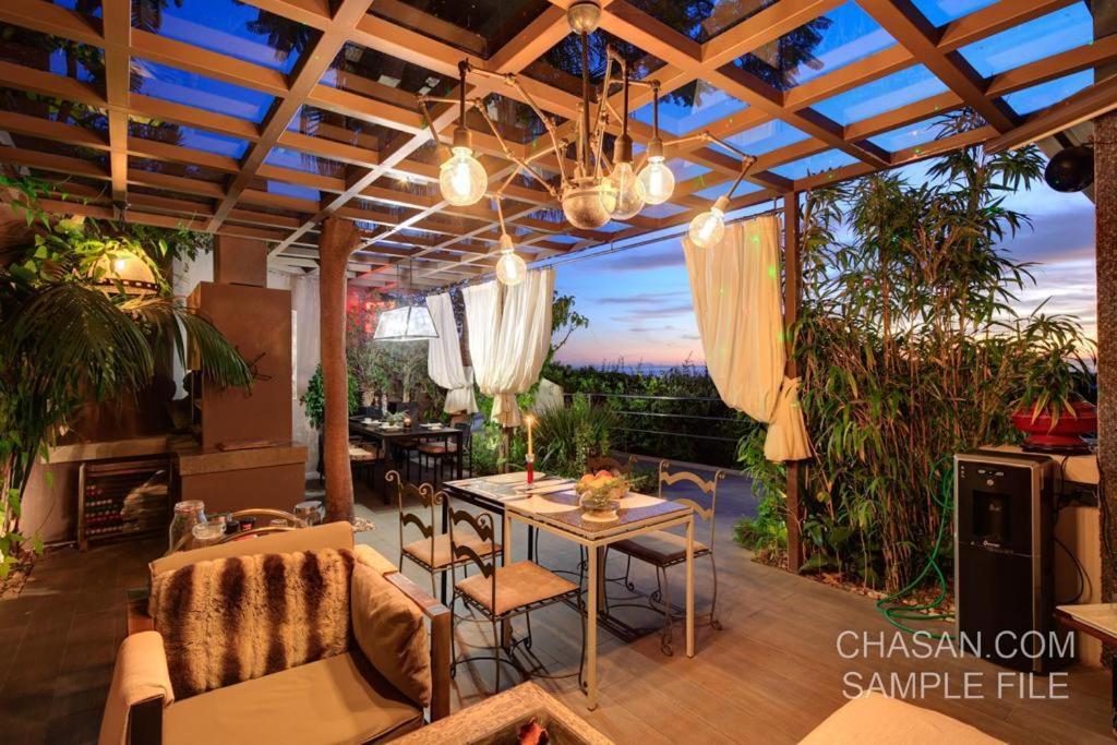 a patio with a table and chairs and a view at Marbella Boutique Art suites in Marbella