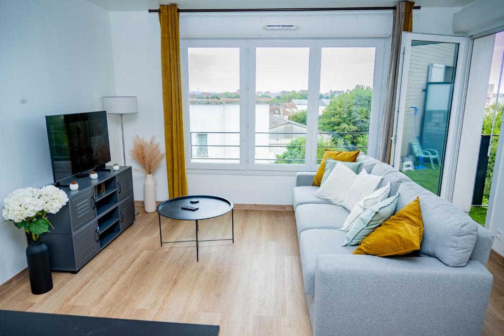 Μια τηλεόραση ή/και κέντρο ψυχαγωγίας στο Logement cosy près des sites JO