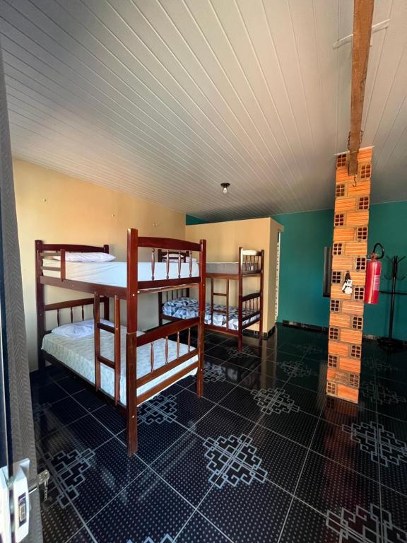 Postel nebo postele na pokoji v ubytování Hostel Caiçara