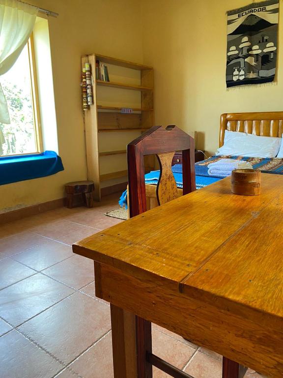 Postel nebo postele na pokoji v ubytování Casa Hotel Loma Wasi en Cotacachi