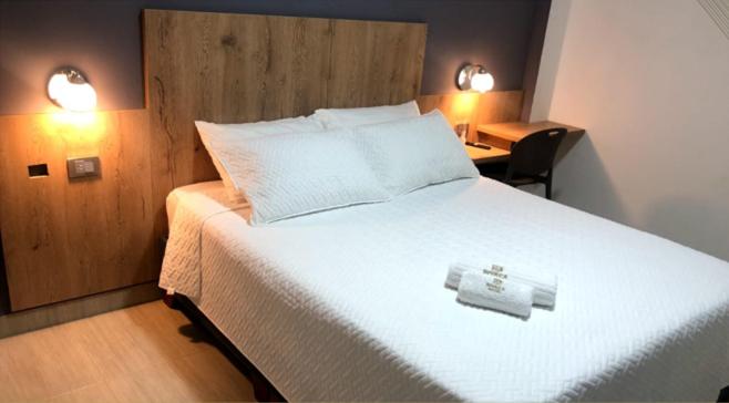 Postel nebo postele na pokoji v ubytování Hotel Divaca