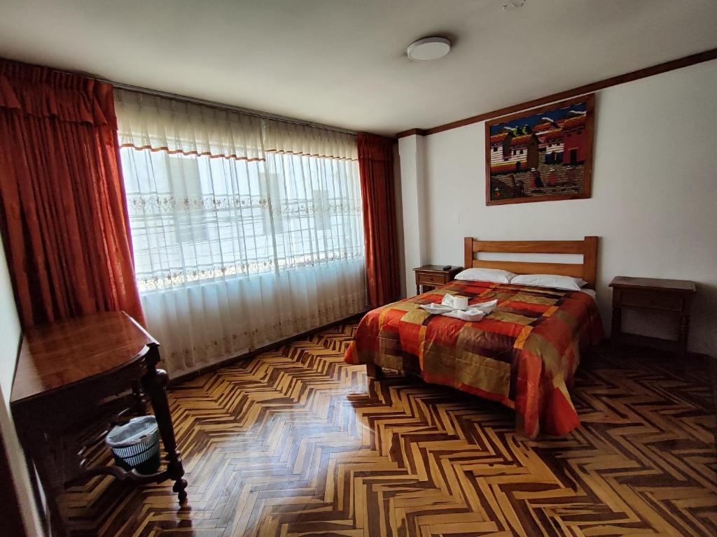 Postel nebo postele na pokoji v ubytování GRAN PUNO lNN