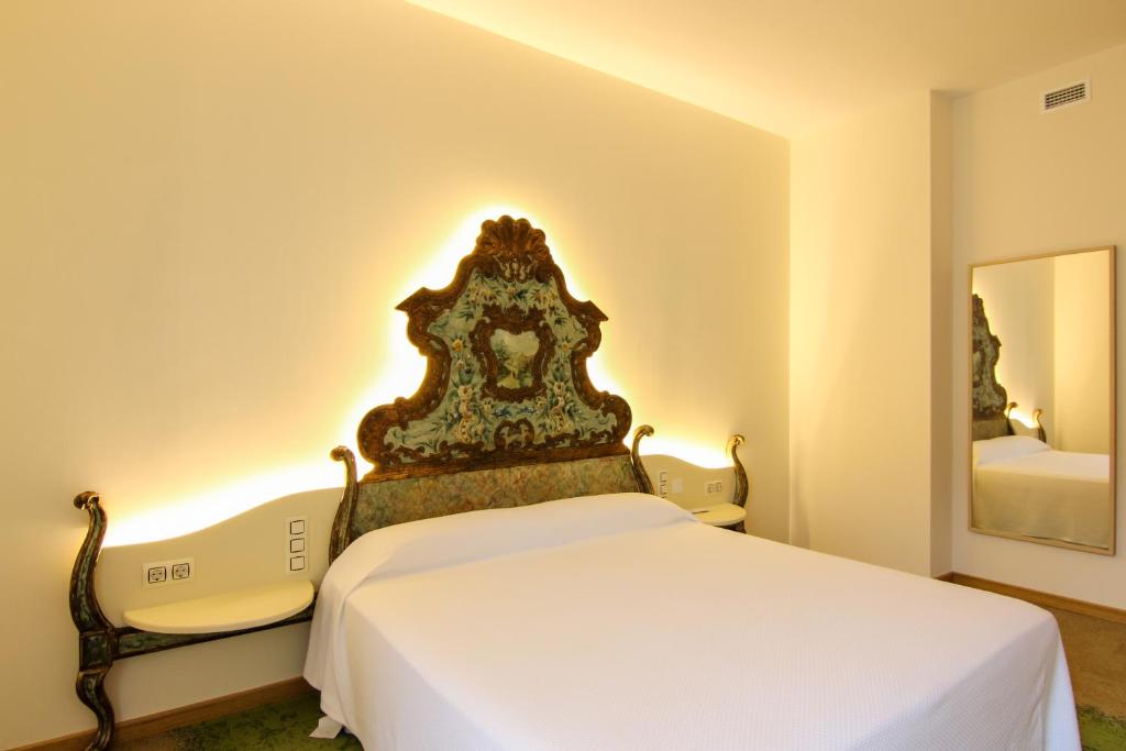 Posteľ alebo postele v izbe v ubytovaní Hotel Cal Piteu