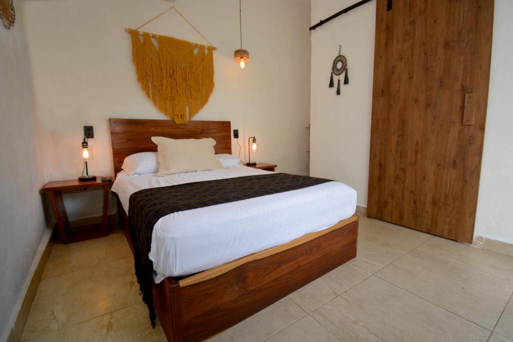 Postel nebo postele na pokoji v ubytování Casa Delia Hotel Downtown