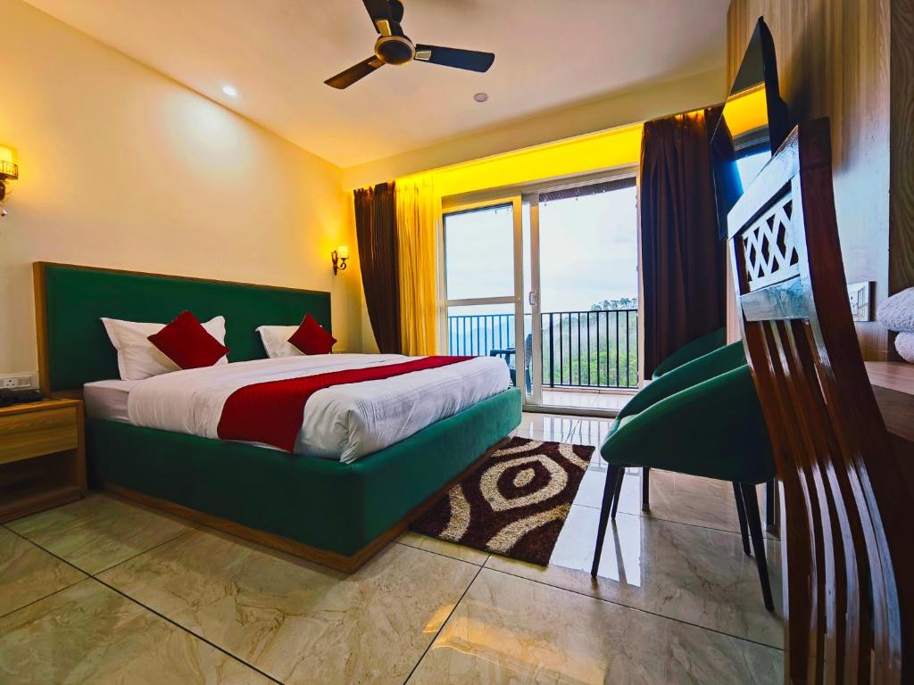 a bedroom with a bed and a balcony at Hotel Pines And Peeks By Tws Hotels in Dalhousie