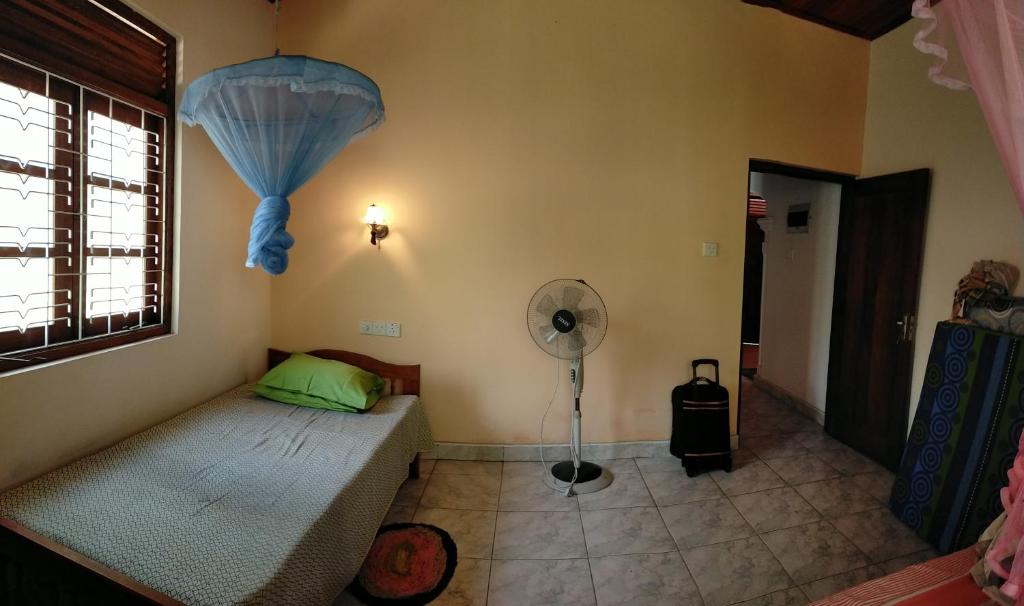 Postel nebo postele na pokoji v ubytování Shady Homestay