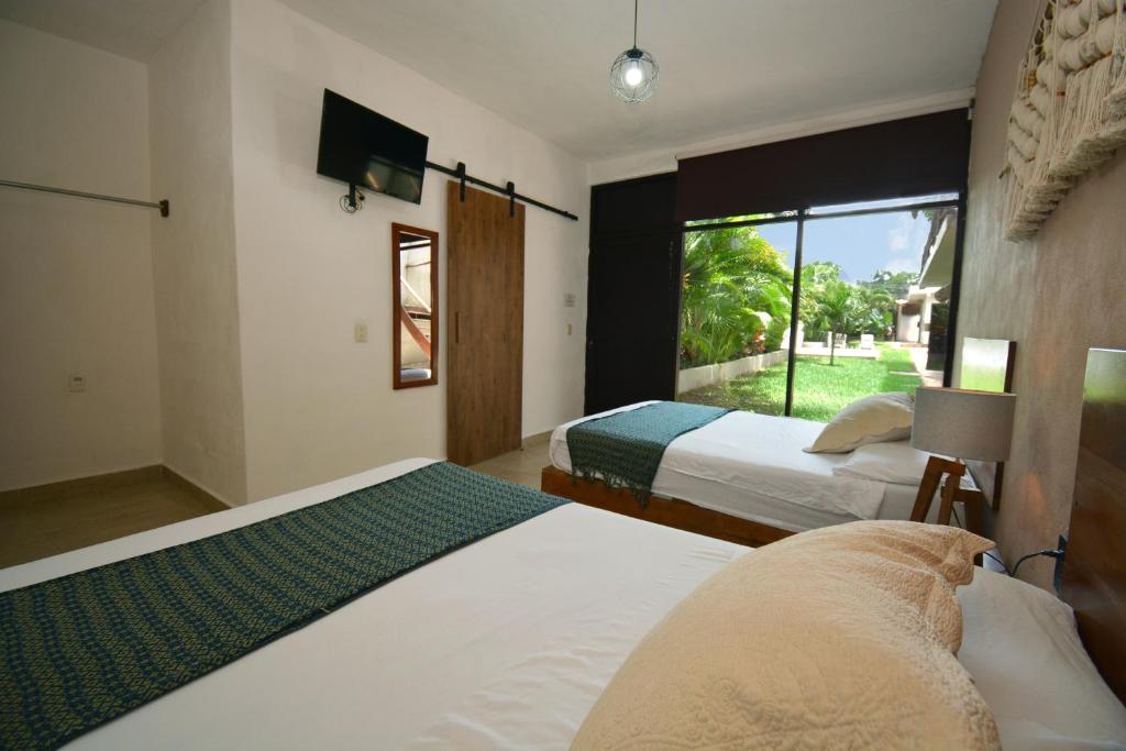 Postel nebo postele na pokoji v ubytování Casa Delia Hotel Downtown