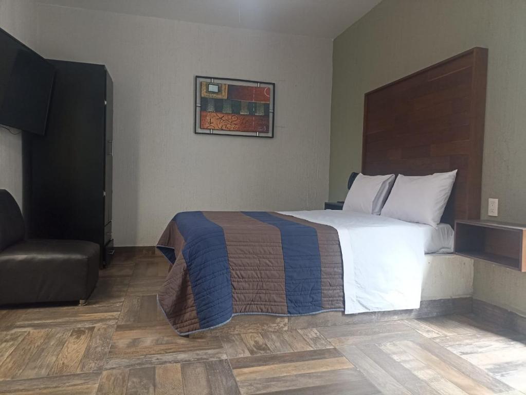 Postel nebo postele na pokoji v ubytování Hotel Dalia