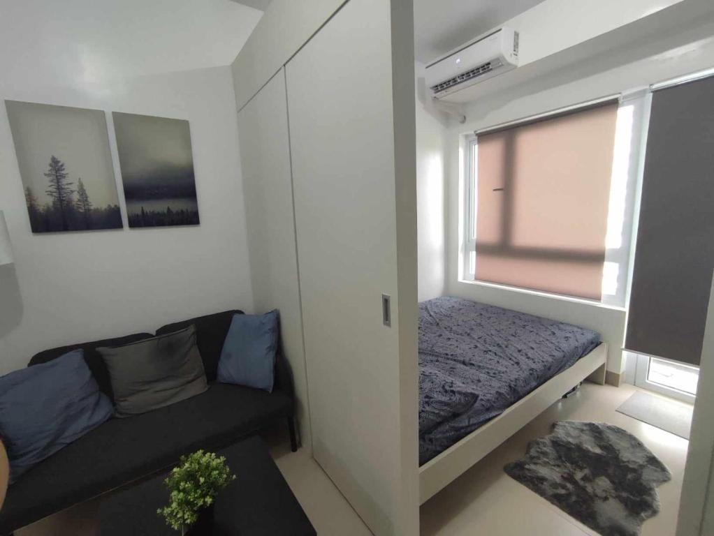 Voodi või voodid majutusasutuse SFC Cool Suites by SMDC Tagaytay toas