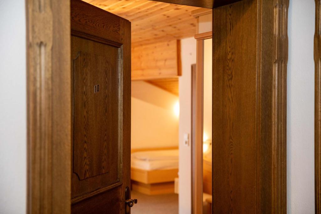 Postel nebo postele na pokoji v ubytování Pension Mozart