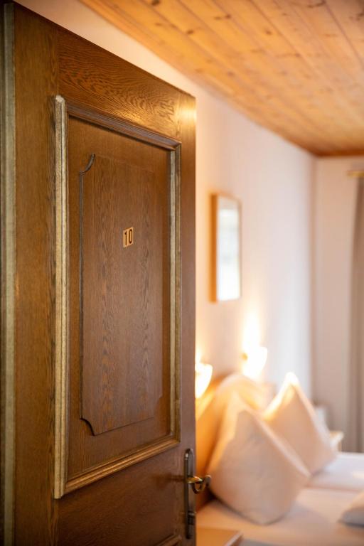 Postel nebo postele na pokoji v ubytování Pension Mozart