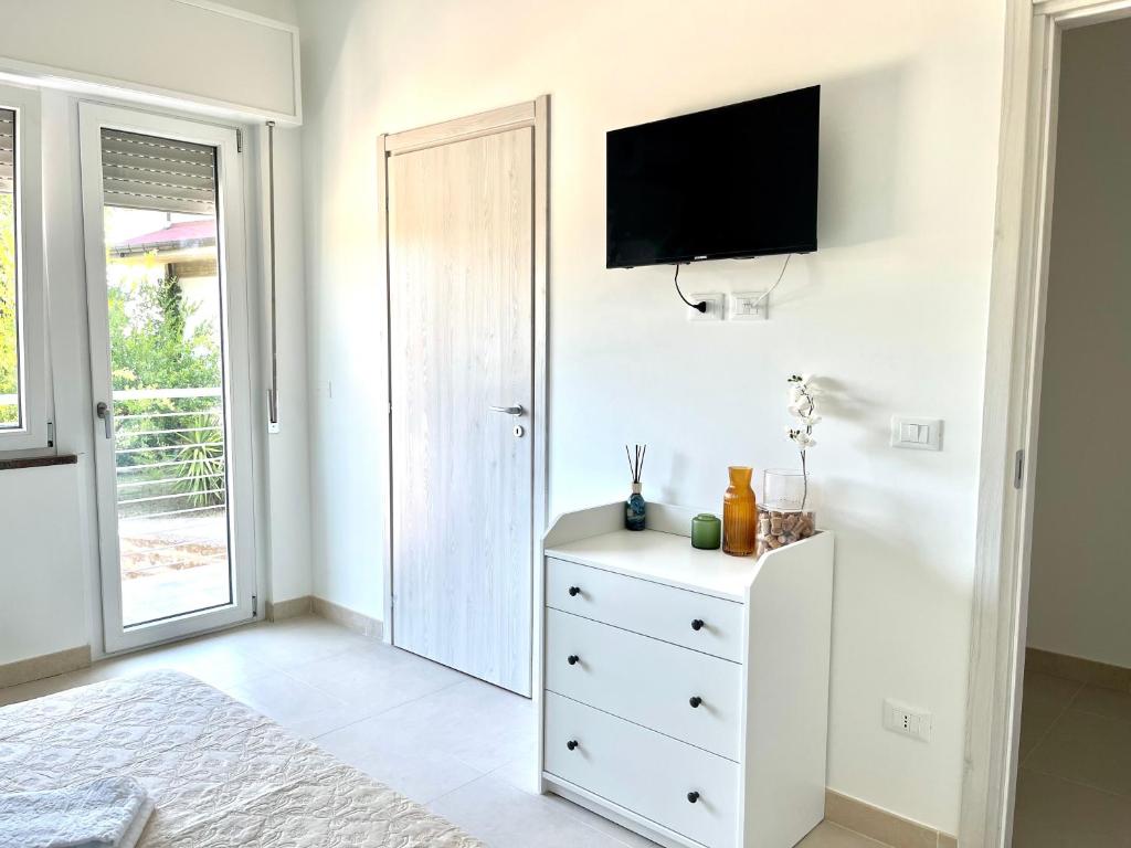 TV a/nebo společenská místnost v ubytování Il Vigneto Suite
