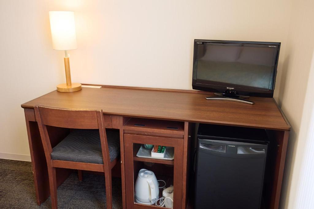 TV a/nebo společenská místnost v ubytování Ginza International Hotel