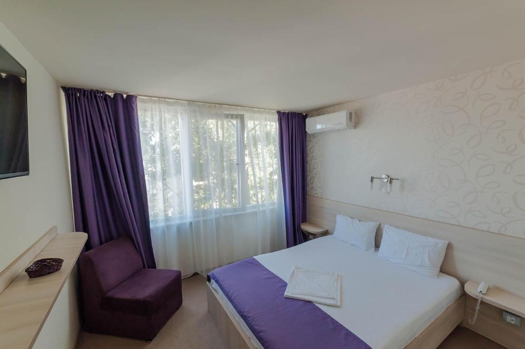 Postel nebo postele na pokoji v ubytování Hotel Doina