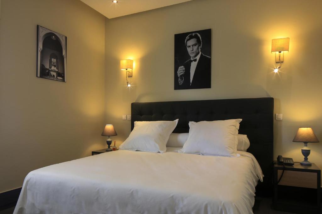 Postel nebo postele na pokoji v ubytování Le Sphinx Boutique Hôtel
