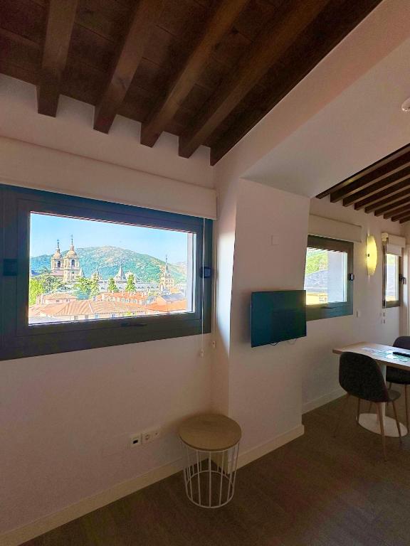 TV a/nebo společenská místnost v ubytování San Lorenzo Suites