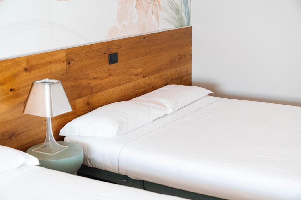 Postel nebo postele na pokoji v ubytování Locanda Da I Baldi