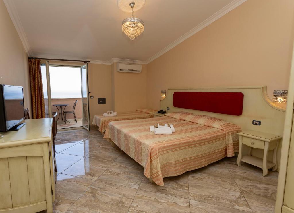 Postel nebo postele na pokoji v ubytování Hotel Terrazzo Sul Mare