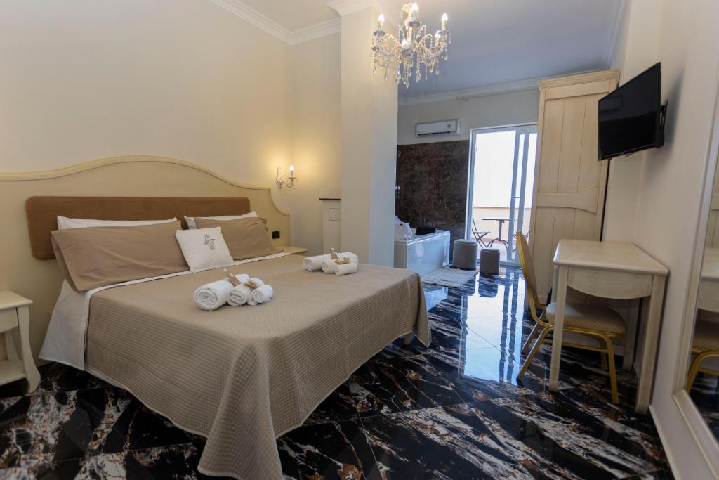 Postel nebo postele na pokoji v ubytování Hotel Terrazzo Sul Mare