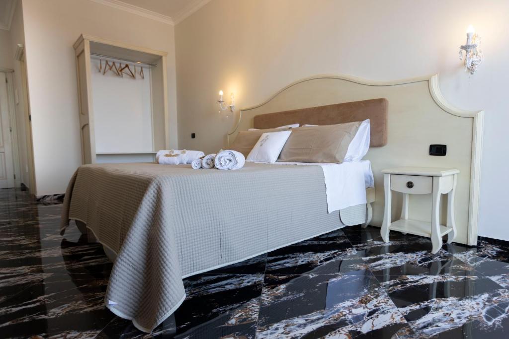 Postel nebo postele na pokoji v ubytování Hotel Terrazzo Sul Mare