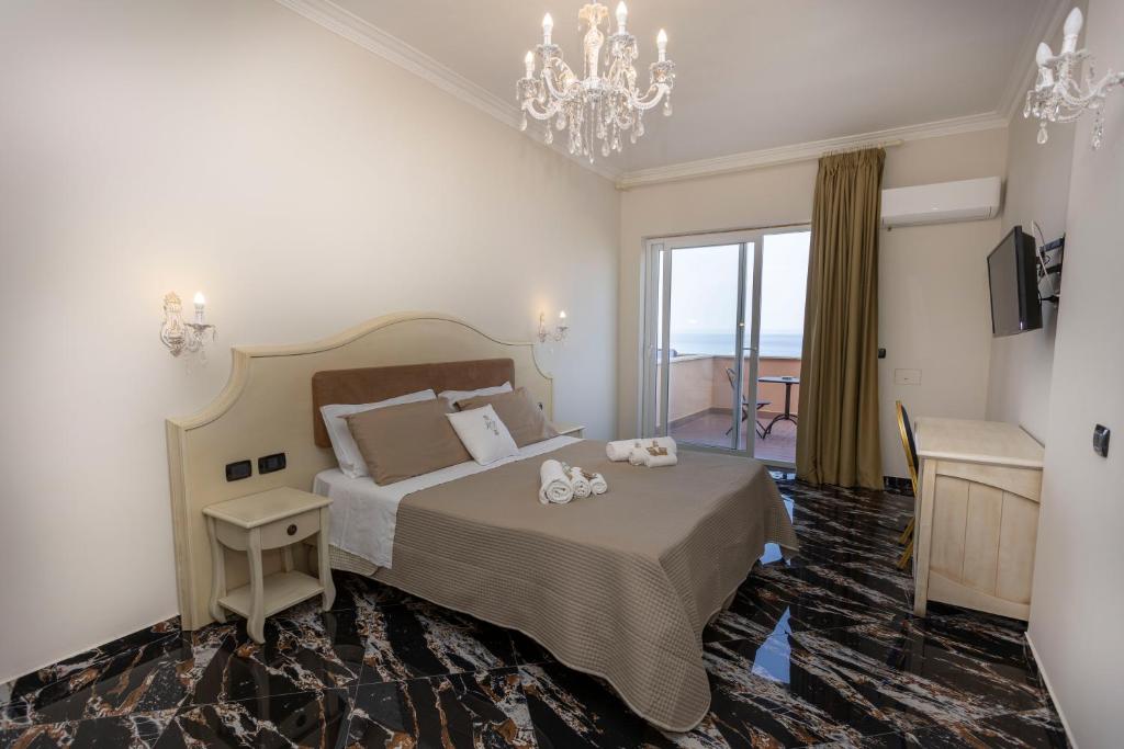 Postel nebo postele na pokoji v ubytování Hotel Terrazzo Sul Mare