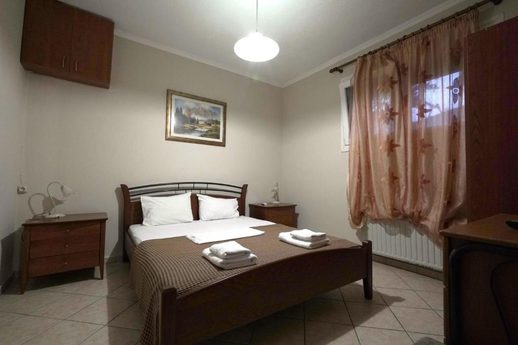 Postel nebo postele na pokoji v ubytování Anestis Studios