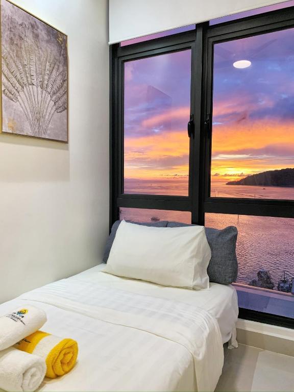 Postel nebo postele na pokoji v ubytování Sea Park LeSu 8 The Shore KK I 1 plus 1 Room 2-5 Pax 홈스테이