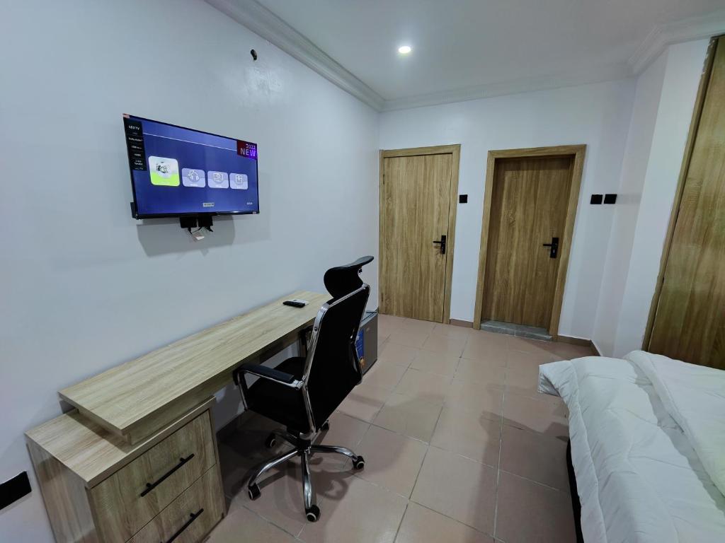 TV a/nebo společenská místnost v ubytování Lekki City View Apartment